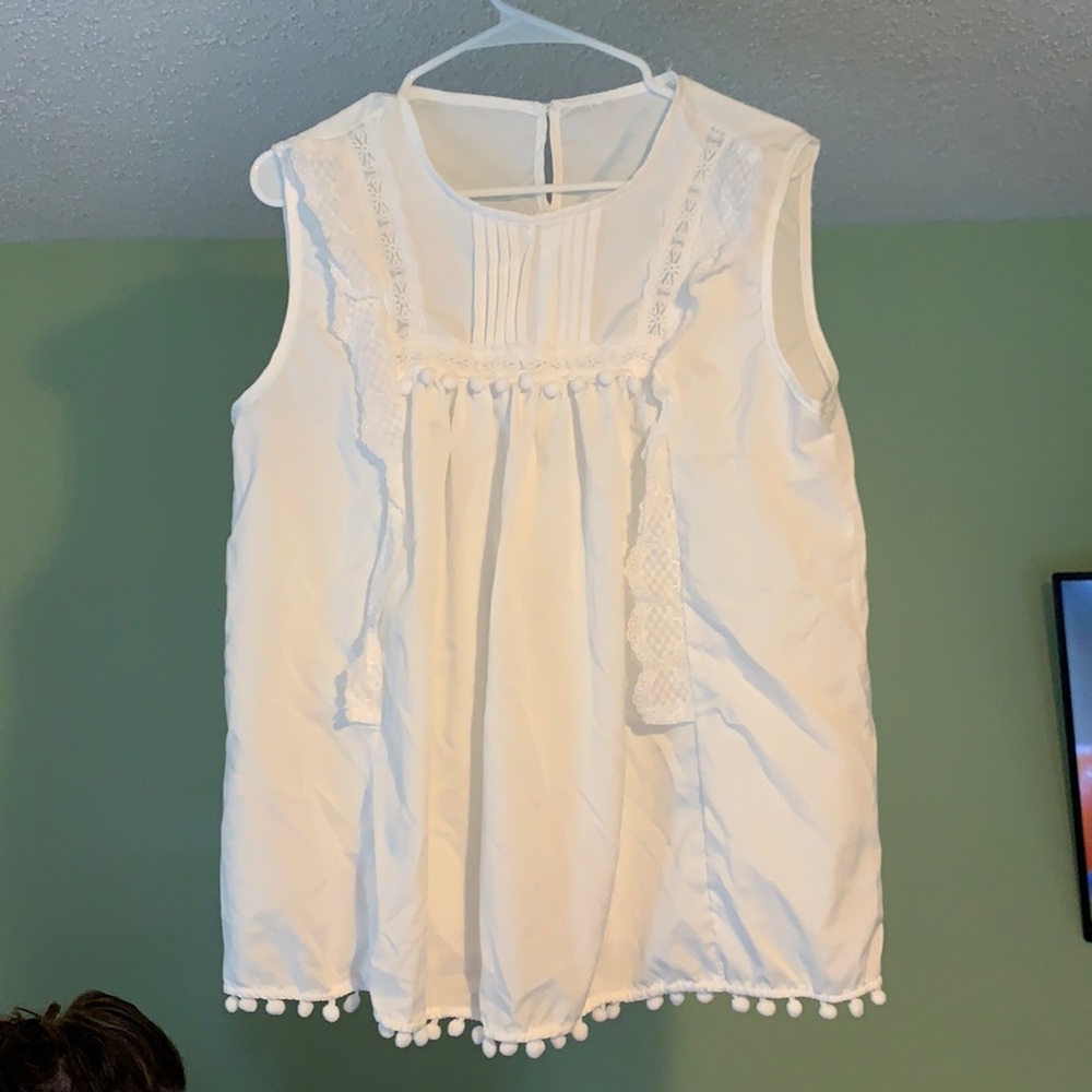 White sleeveless blouse